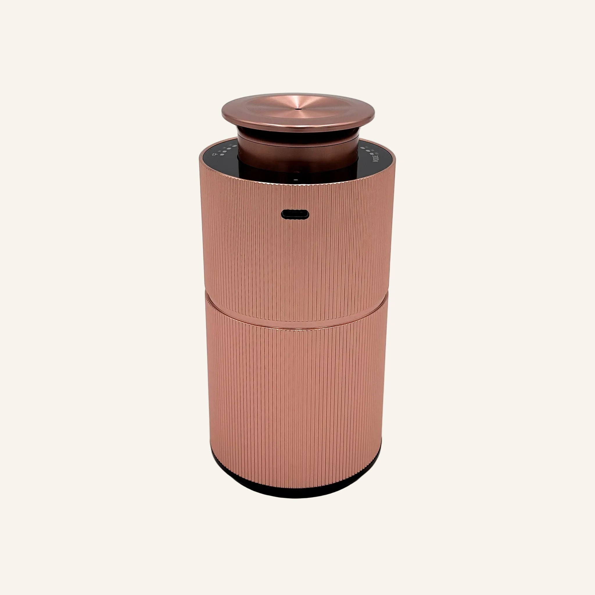 The back of our Rose Gold Copalli Mini Diffuser; Waterless scent diffuser, USB rechargeable port. 