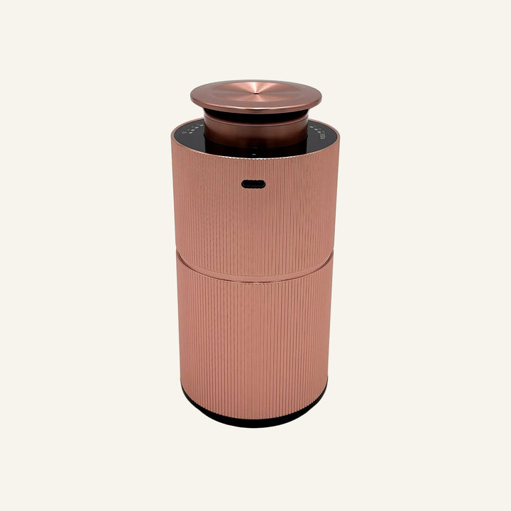 The back of our Rose Gold Copalli Mini Diffuser; Waterless scent diffuser, USB rechargeable port. 