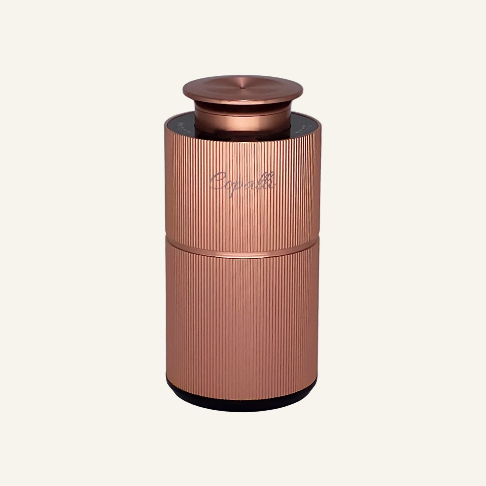 Our Rose Gold Copalli Mini with "Copalli" branding; waterless scent diffuser with fine vertical ridges. 