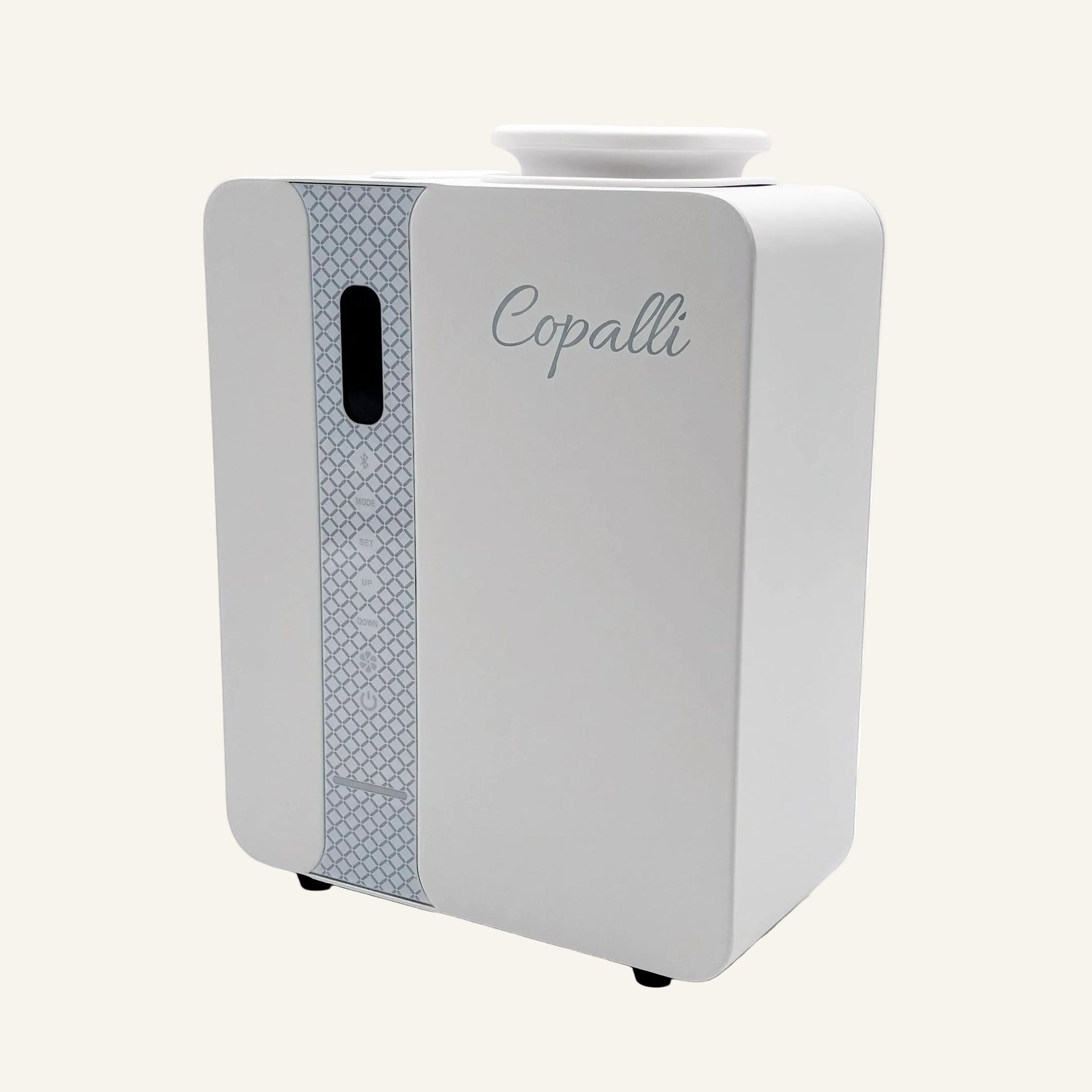 Our white Copalli Pro Diffuser featuring a sleek, rectangular industrial design with a patterned side panel and 'Copalli' branding, centered on a minimalist light cream background.