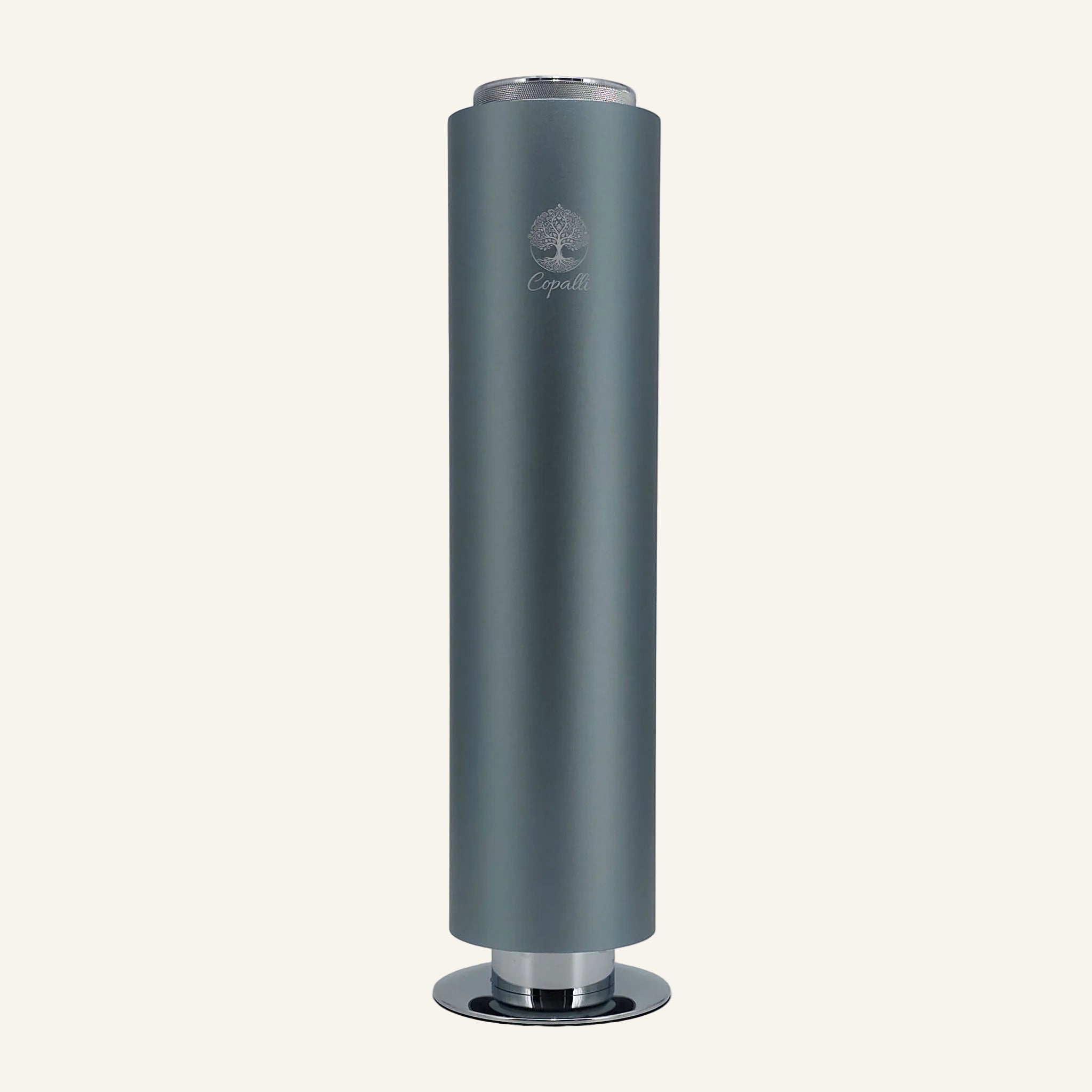 Our Nebula Blue Tower Pro Diffuser by Copalli, featuring a deep metallic blue finish and a minimalist tree logo, centered on a light cream background.