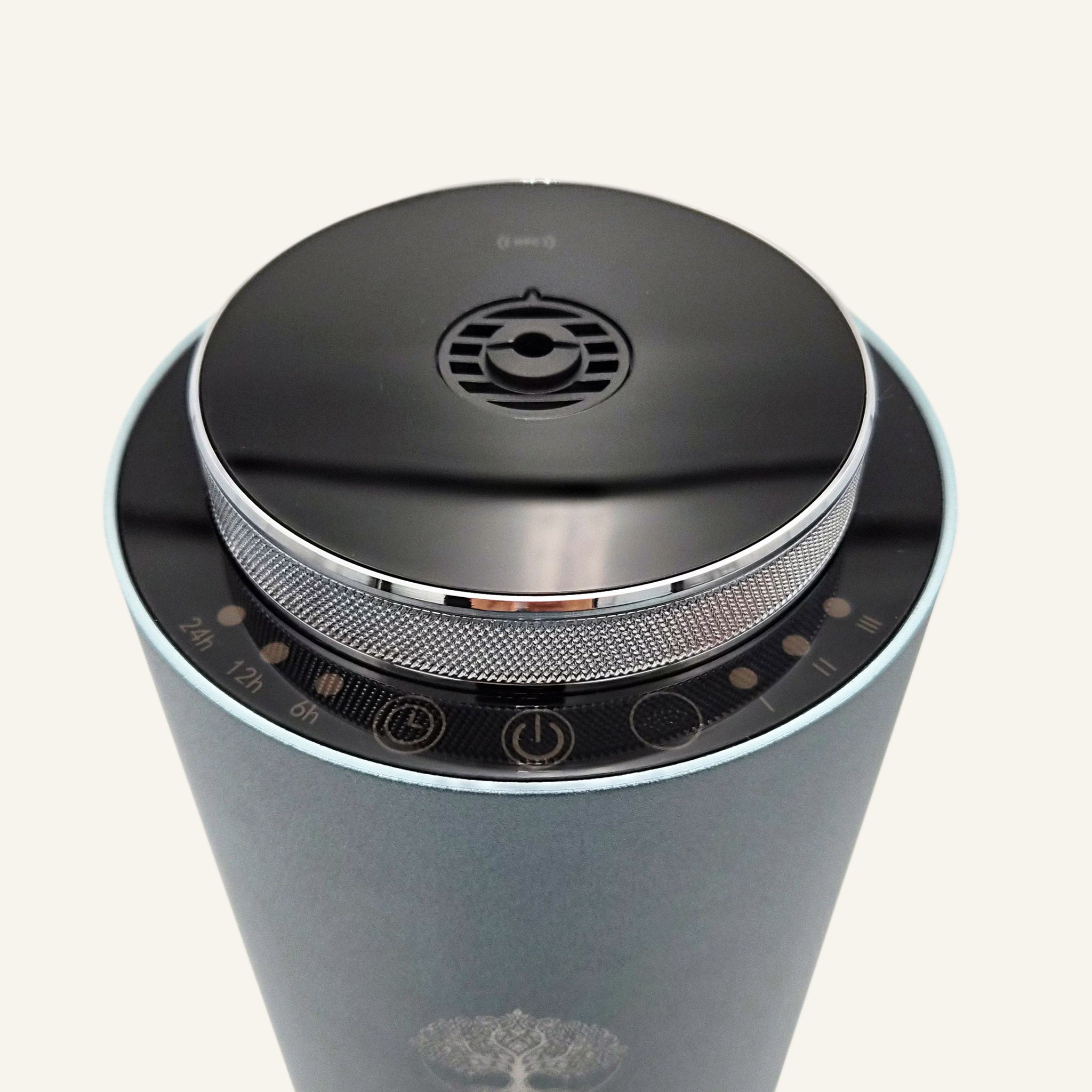 Top view of the Tower Pro Diffuser by Copalli, highlighting the sleek black circular control panel and metallic mesh detail on a professional-grade aluminum body."